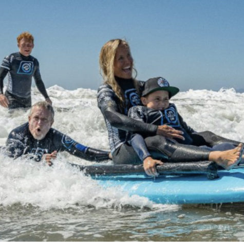 ‘Life Rolls On’ participant surfs on an
adaptive surfboard.