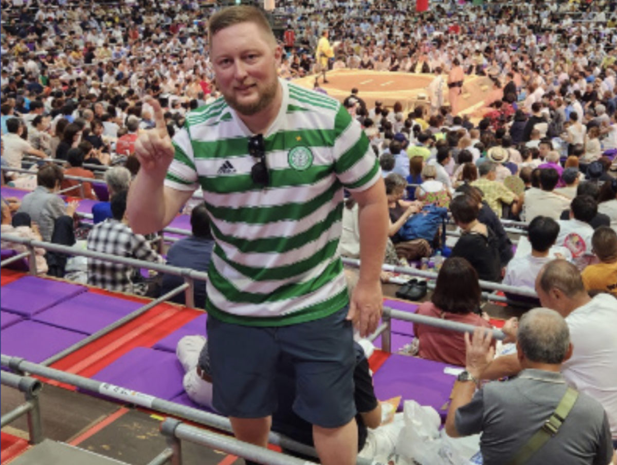 Mr. McIvor attends a sumo wrestling tournament to learn more about Japanese traditions.