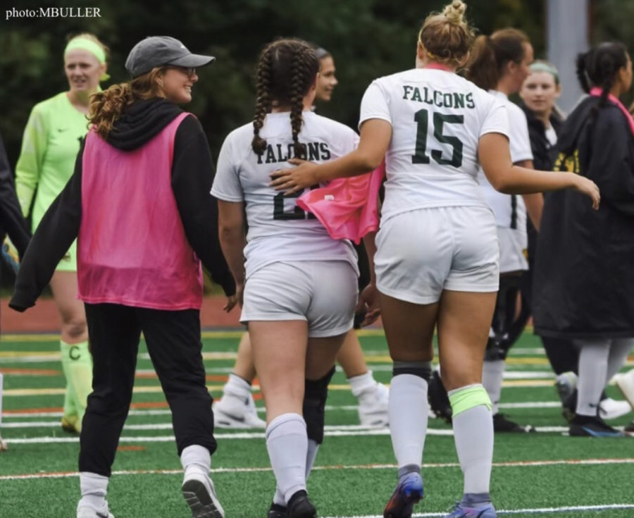 ELHS Alum Malarie Buller, left in pink jersey, at a team practice at Fitchburg State out with a concussion.