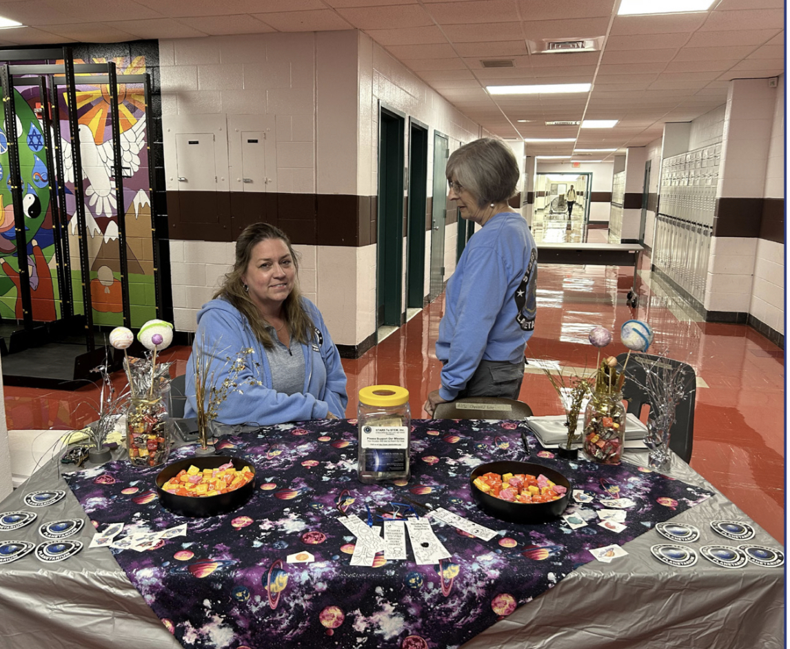 Ms. Swan and Ms. Raff sat ready to greet the guests coming to the summer shows with a table of astronomy themed treats.