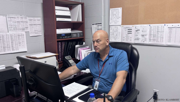 Officer Don brainstorms in his office.
