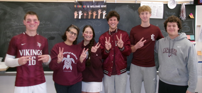 Ms. Ferryman stands with students from her AP statistics class